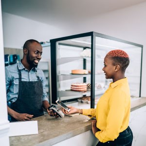 Woman paying at counter